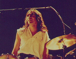 Nigel standing behind drums
